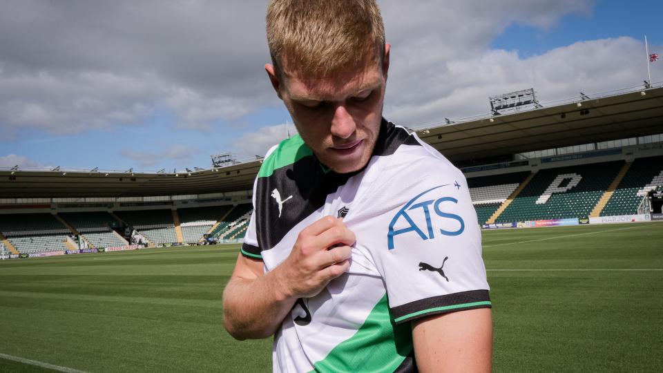 Sam Cosgrove models away kit