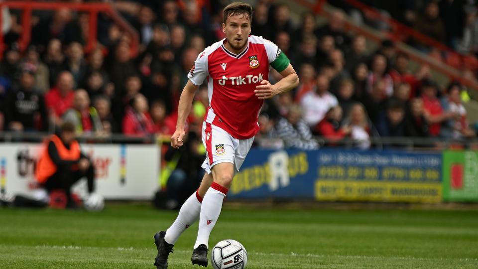 Luke Young playing for Wrexham