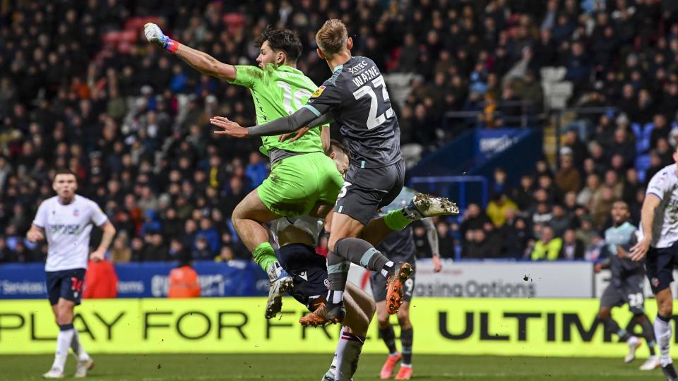 Ben Waine challenges for the ball