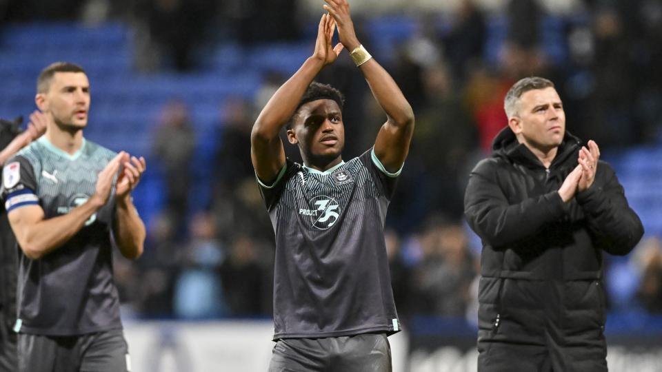 James Wilson, Bali Mumba ans Steven Schumacher clapping fans at Bristol Rovers