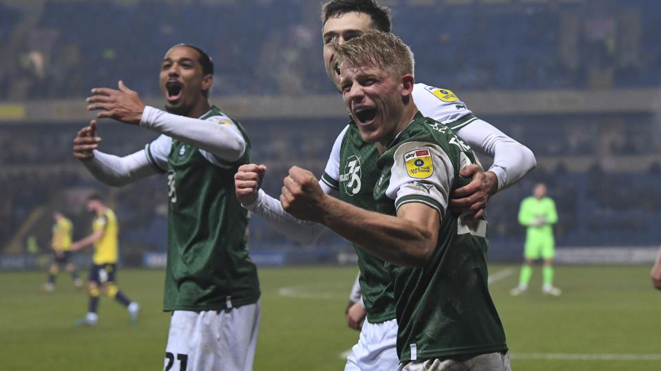 Saxon Earley celebrates scoring against Oxford United