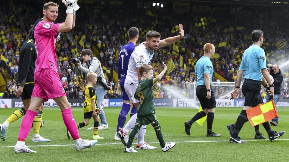 Joe Edwards with a mascot at Watford
