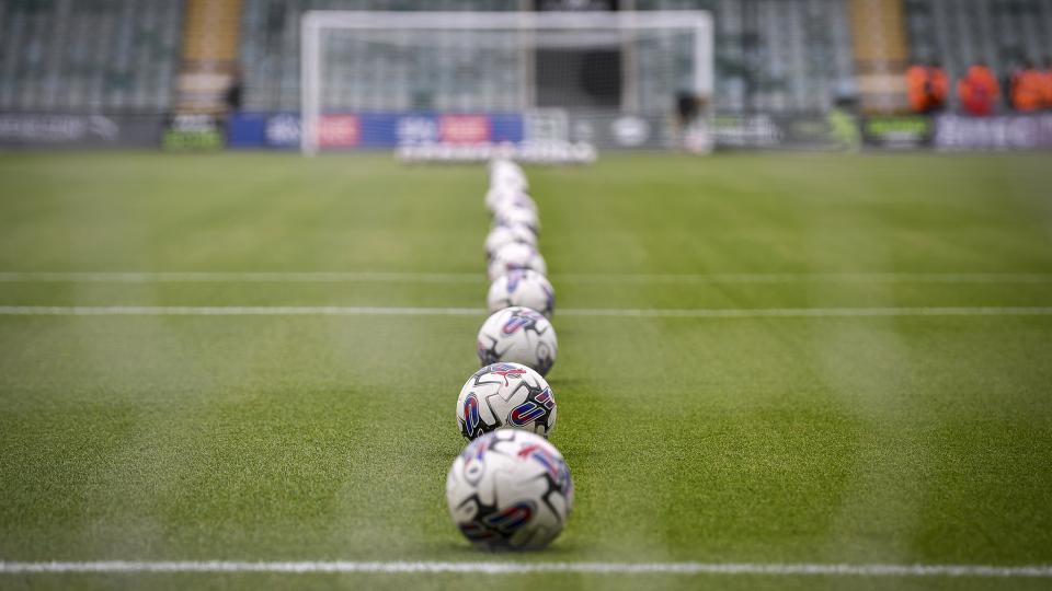 Football pitch with footballs
