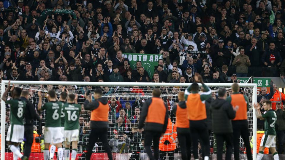 Plymouth Argyle players applaud fans at Anfield 