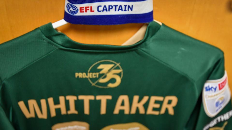 Whittaker's shirt hanging in the dressing room with the Captain's armband