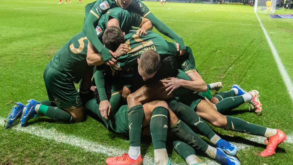 Argyle players celebrate after a late winner against Rotherham