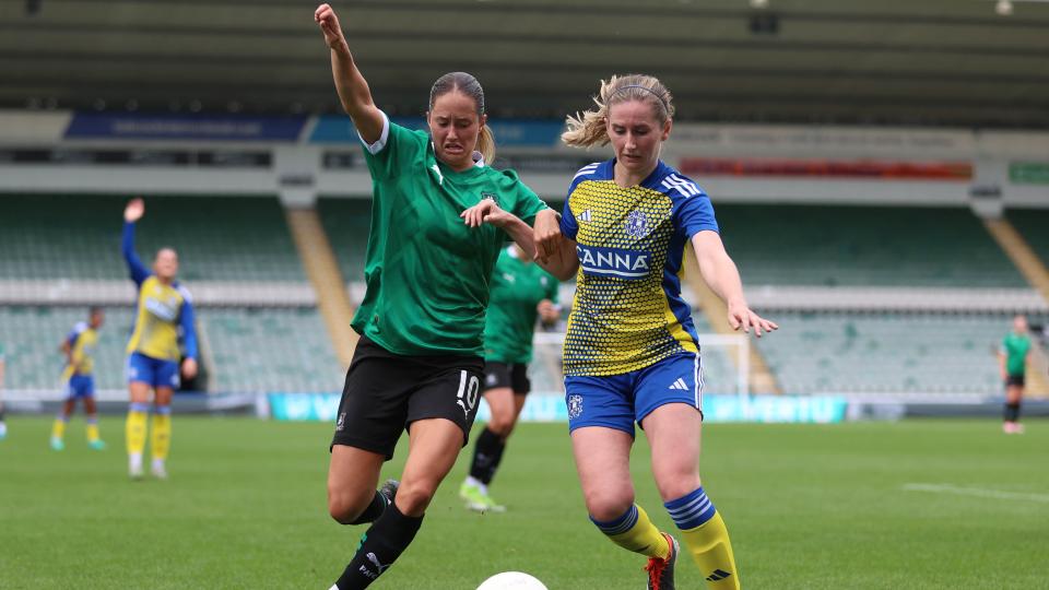 Georgia Wilson battles for the ball