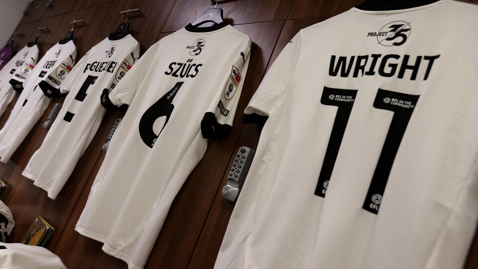 Shirts hang up in away dressing room