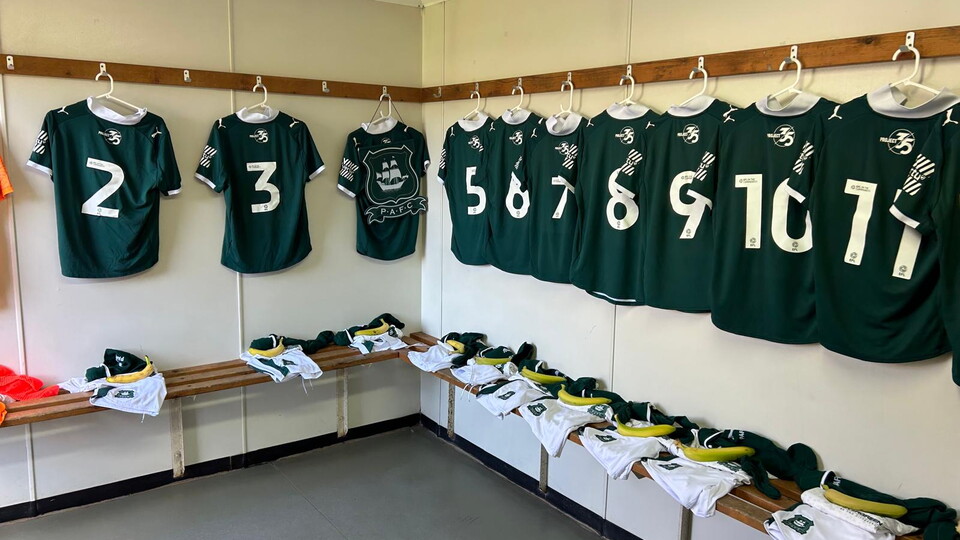 Argyle shirts hung up in a dressing room
