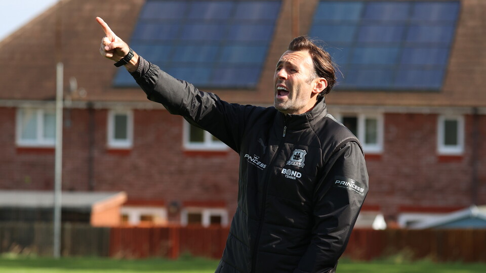 Head Coach Jamie Lowry shouting instructions to his side.
