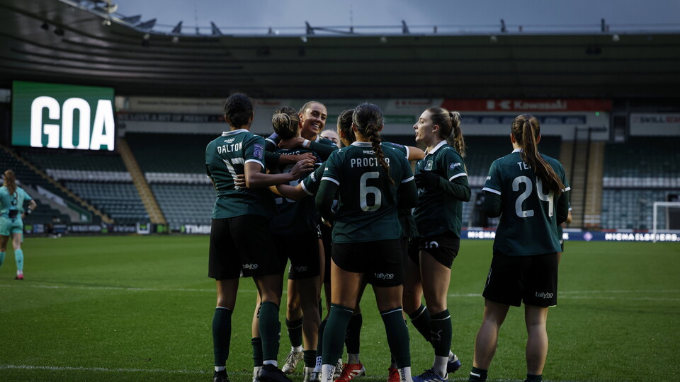 Argyle players celebrate after scoring against Real Bedford at Home Park.