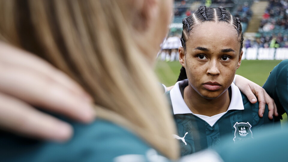 A close-up shot of Tamara Wilcock, in the team huddle at Home Park, ahead of Argyle v Lewes.