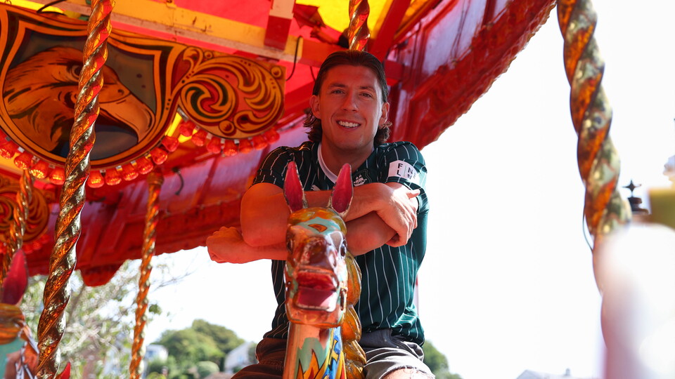 Alex Mitchell on a carousel