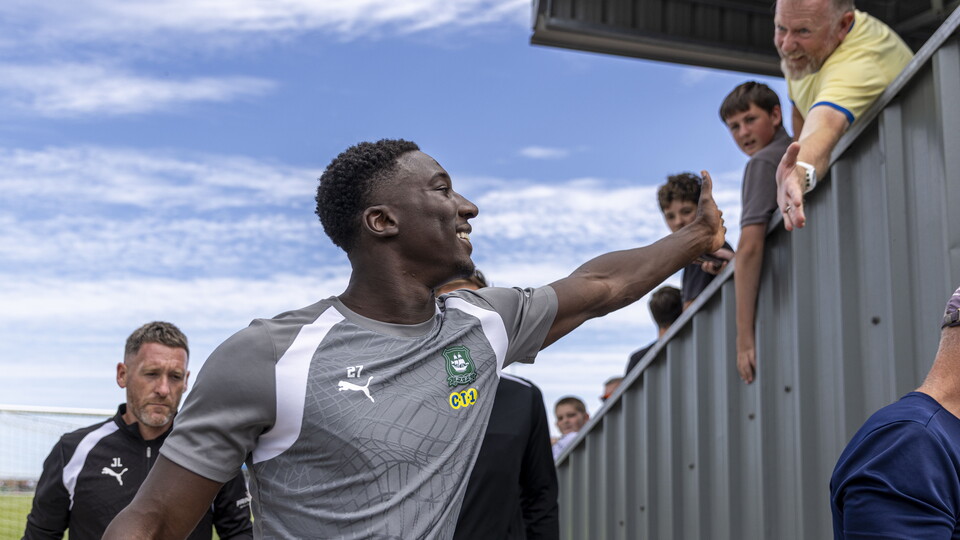 Bim Pepple high-fives an Argyle supporter