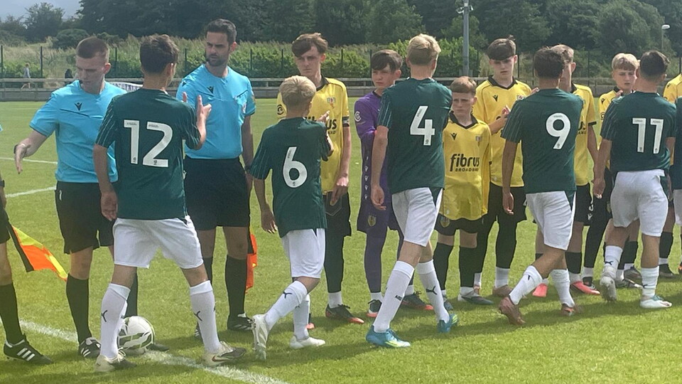Argyle's SuperCupNI squad shaking hands with Country Antrim players before kick-off.