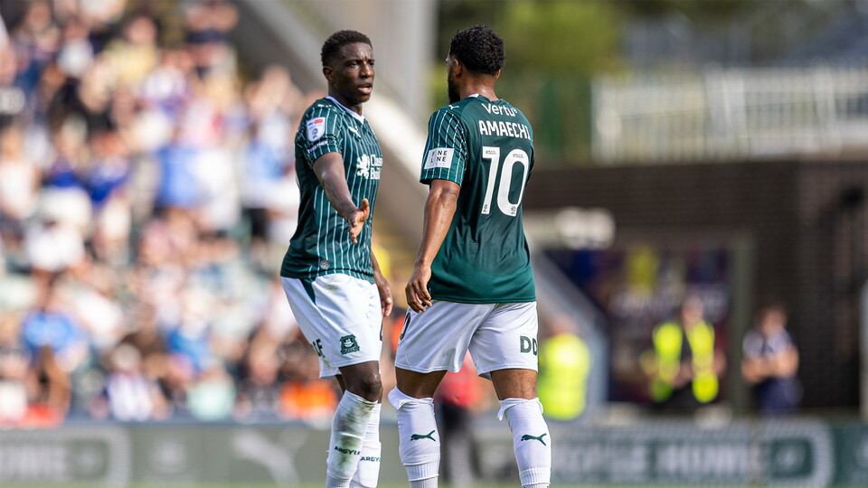 Xavier Amaechi and Wes Harding against Stockport County