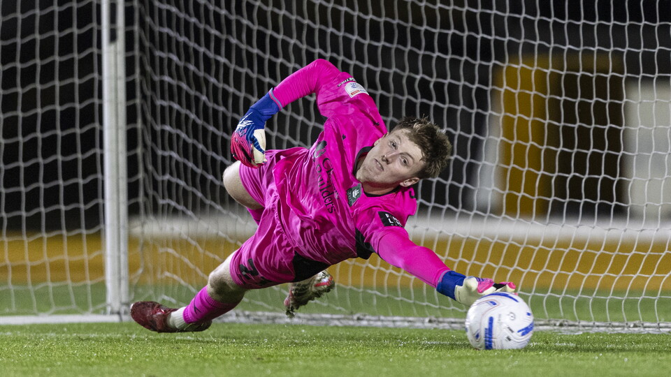James Storer saves a penalty against Newport County