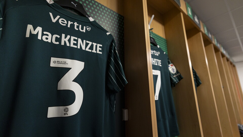 Shirt number 3 for Mackenzie hanging in a changing room
